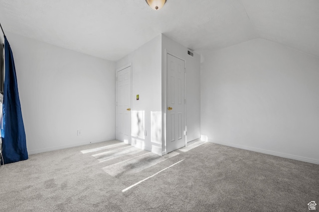 779 S 400 E, Salt Lake City, UT 84111 - unfurnished bedroom with carpet floors, baseboards, visible vents, and lofted ceiling