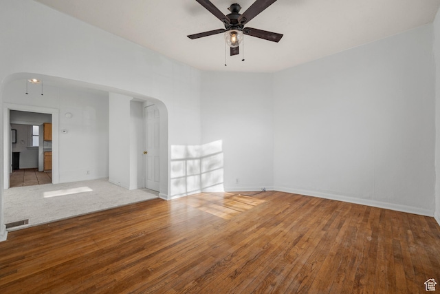 779 S 400 E, Salt Lake City, UT 84111 - empty room with wood-type flooring, arched walkways, a ceiling fan, baseboards, and visible vents