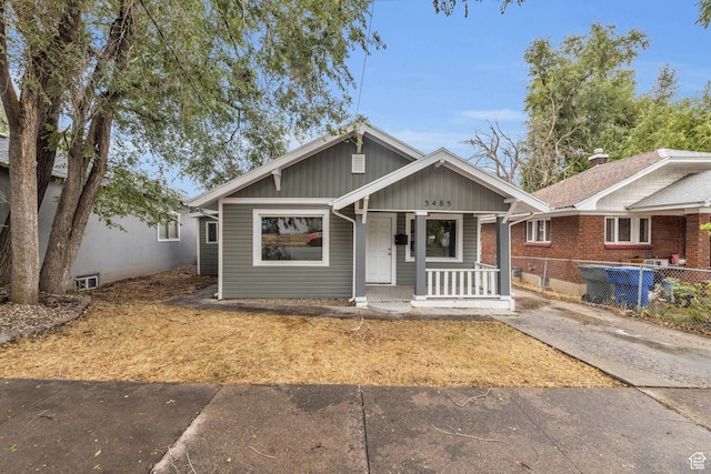 3485 S Grant Ave, Ogden, UT 84403 - bungalow featuring board and batten siding, fence, and covered porch