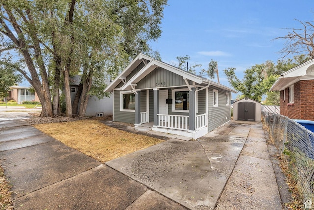 3485 S Grant Ave, Ogden, UT 84403 - bungalow featuring an outdoor structure, fence, covered porch, a shed, and concrete driveway