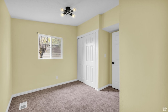 3485 S Grant Ave, Ogden, UT 84403 - unfurnished bedroom with carpet flooring, baseboards, visible vents, and a closet