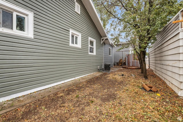 3485 S Grant Ave, Ogden, UT 84403 - view of side of home featuring central AC and fence