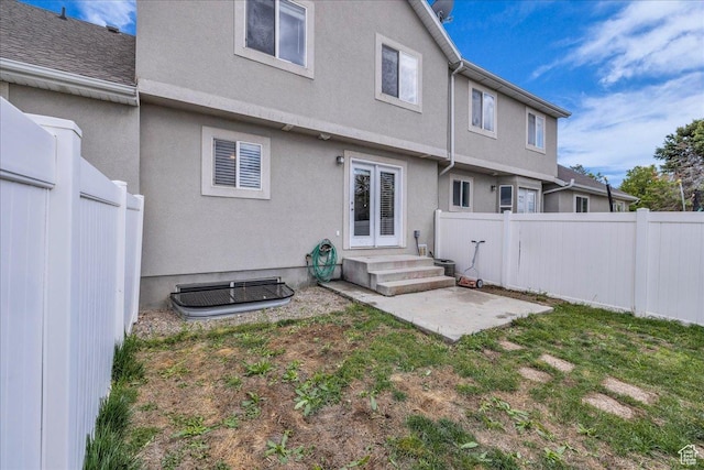 3909 N Davencourt Loop, Lehi, UT 84043 - back of house featuring a fenced backyard, a patio, stucco siding, and a yard