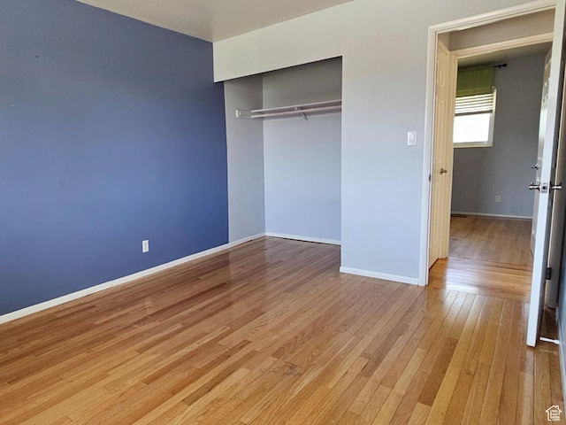302 E 1400 N, Bountiful, UT 84010 - unfurnished bedroom featuring light wood finished floors and a closet