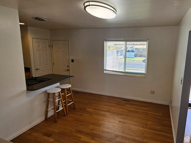 302 E 1400 N, Bountiful, UT 84010 - unfurnished dining area with dark wood finished floors and baseboards