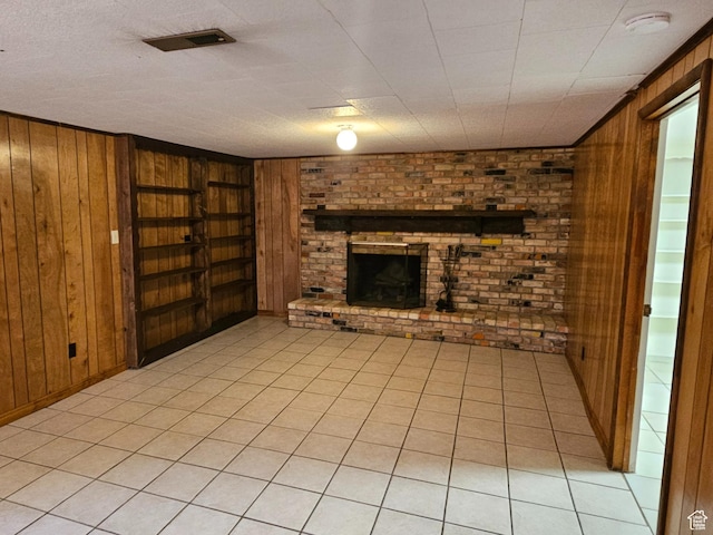 302 E 1400 N, Bountiful, UT 84010 - unfurnished living room with wooden walls, a brick fireplace, and built in features