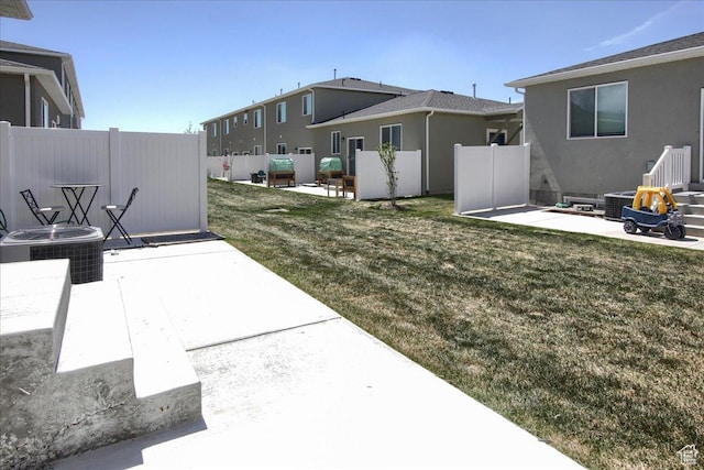 200 W 1200 S Unit 61, Tremonton, UT 84337 - view of yard featuring fence, central air condition unit, and a patio area