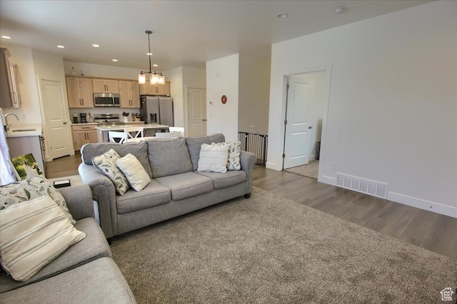 200 W 1200 S Unit 61, Tremonton, UT 84337 - living area featuring visible vents, baseboards, dark wood-style floors, a chandelier, and recessed lighting
