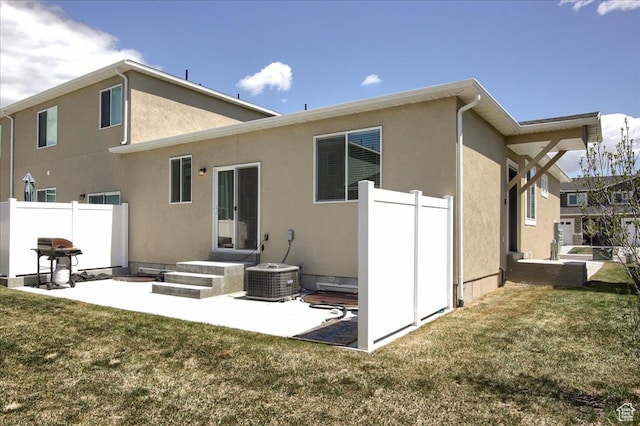 200 W 1200 S Unit 61, Tremonton, UT 84337 - back of house with fence, a patio, stucco siding, and a yard
