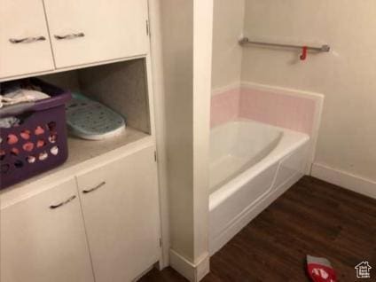 98 W 600 N, Logan, UT 84321 - full bathroom with a washtub, baseboards, and wood finished floors
