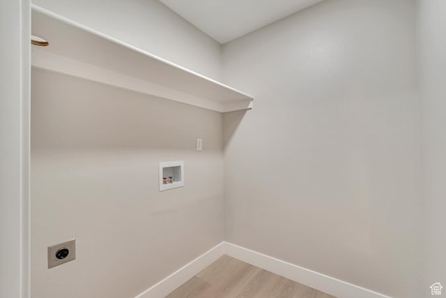 339 E 600 S Unit 1210, Salt Lake City, UT 84111 - laundry area with laundry area, baseboards, light wood-style floors, electric dryer hookup, and washer hookup