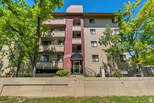 339 E 600 S Unit 1210, Salt Lake City, UT 84111 - view of building exterior featuring fence
