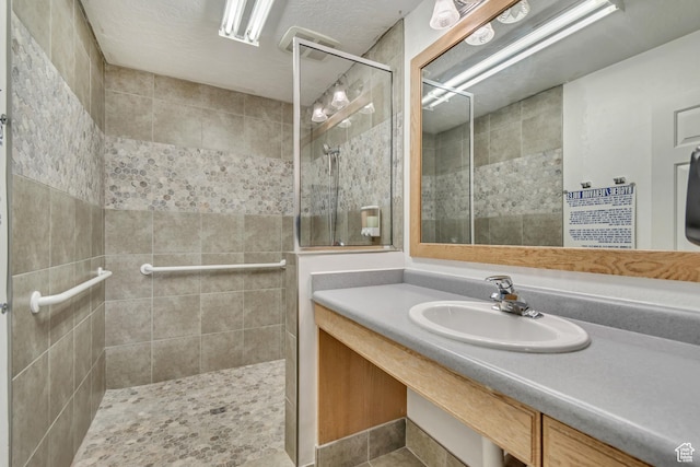 339 E 600 S Unit 1210, Salt Lake City, UT 84111 - bathroom featuring vanity and a tile shower