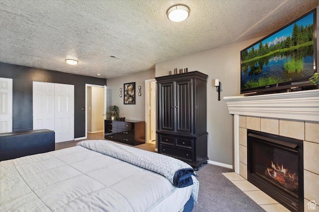 121 N 3000 W, West Point, UT 84015 - carpeted bedroom with baseboards, a fireplace, a closet, and a textured ceiling