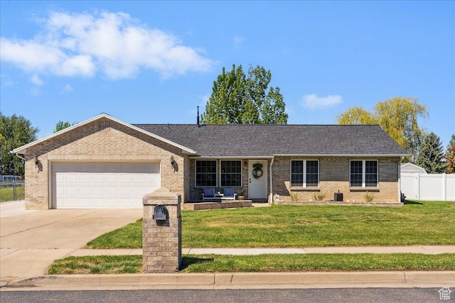 121 N 3000 W, West Point, UT 84015 - ranch-style home featuring brick siding, fence, driveway, and a front yard