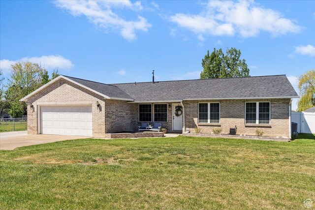 121 N 3000 W, West Point, UT 84015 - ranch-style house with driveway, a front yard, a garage, brick siding, and fence