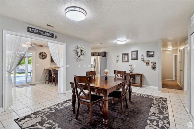 121 N 3000 W, West Point, UT 84015 - dining space with visible vents, baseboards, ceiling fan, a textured ceiling, and light tile patterned floors