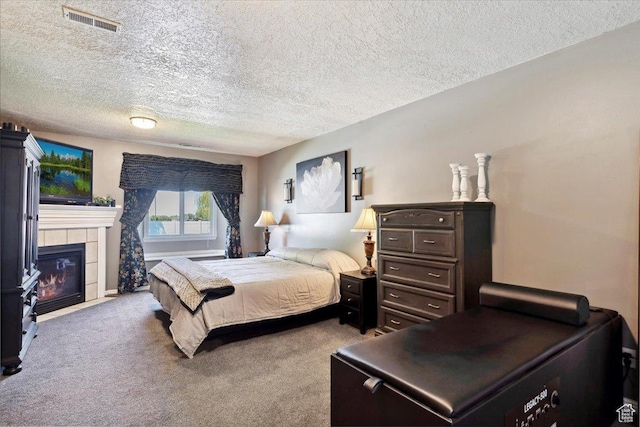 121 N 3000 W, West Point, UT 84015 - bedroom with carpet floors, a textured ceiling, visible vents, and a tile fireplace