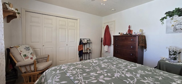 bedroom featuring a ceiling fan and a closet