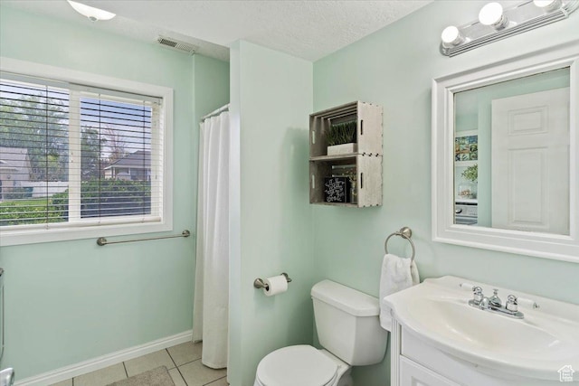 1090 N 3450 W, Layton, UT 84041 - full bathroom with visible vents, tile patterned flooring, vanity, baseboards, and toilet