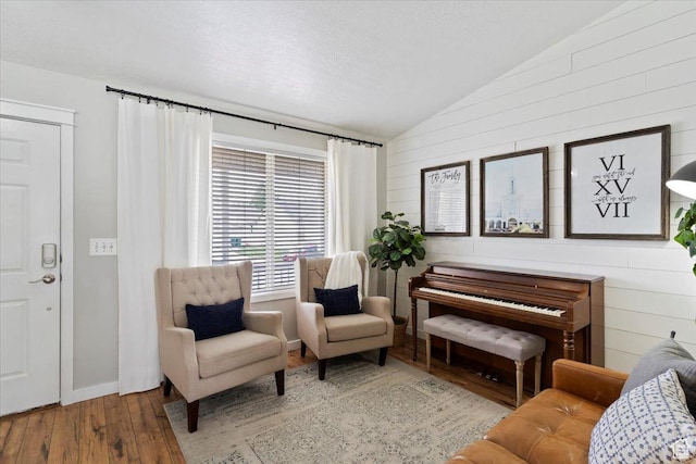 1090 N 3450 W, Layton, UT 84041 - living area featuring hardwood / wood-style flooring, wood walls, and lofted ceiling
