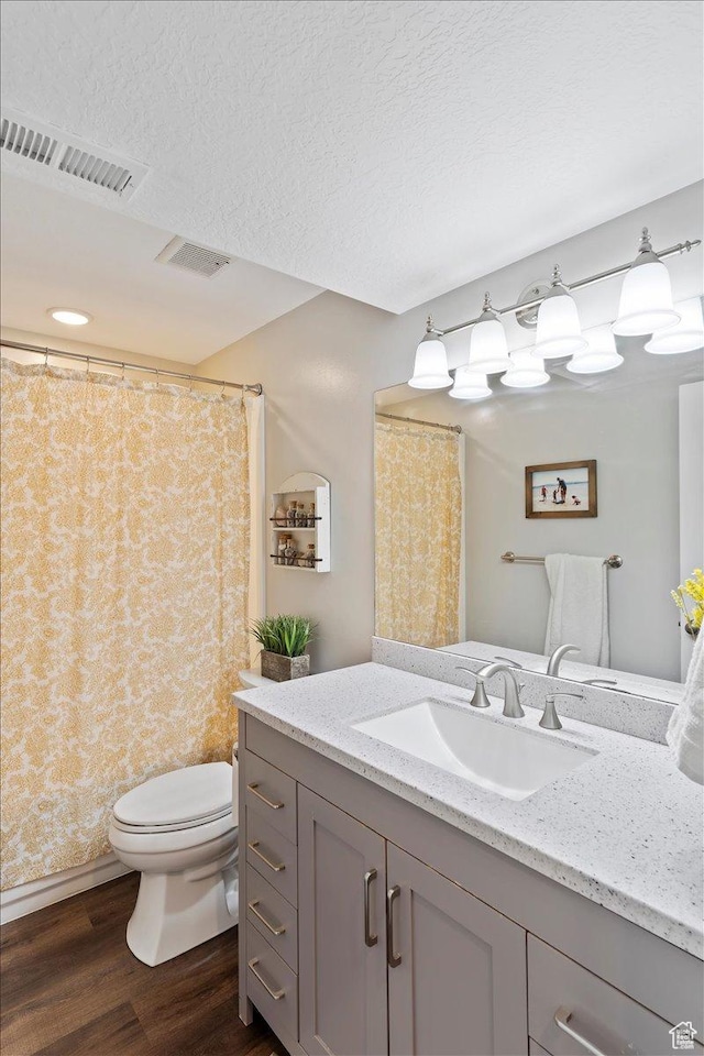 1090 N 3450 W, Layton, UT 84041 - full bathroom featuring visible vents, wood finished floors, toilet, and vanity