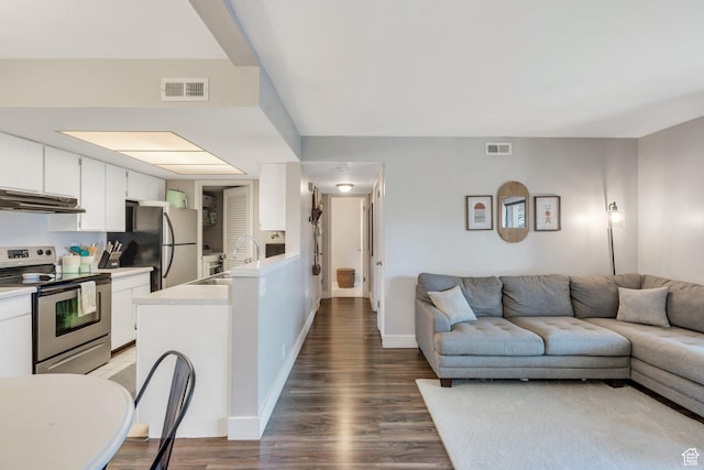 1275 E Shadow Ridge Dr S Unit 10N, Cottonwood Heights, UT 84047 - living room with visible vents, baseboards, and wood finished floors