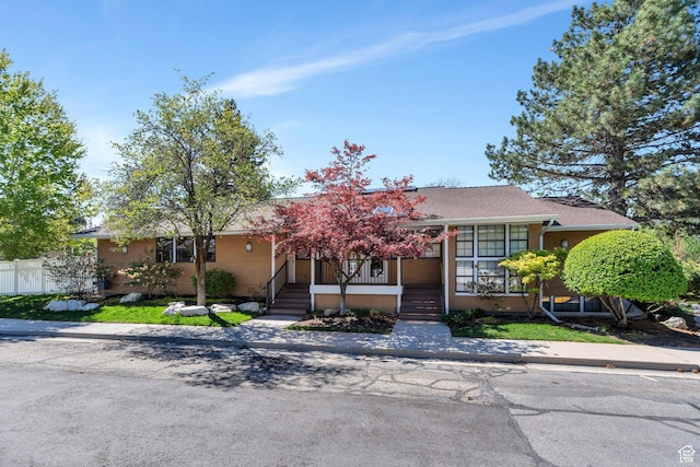 1275 E Shadow Ridge Dr S Unit 10N, Cottonwood Heights, UT 84047 - ranch-style home with a porch and fence