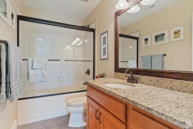 864 S Wellington Dr W, Kaysville, UT 84037 - full bathroom featuring vanity, tile patterned flooring, enclosed tub / shower combo, and toilet