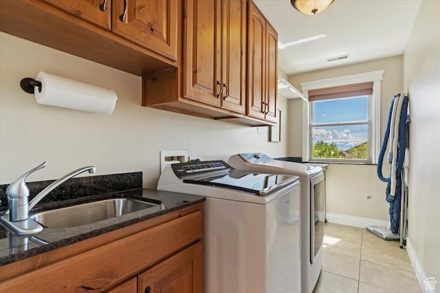 864 S Wellington Dr W, Kaysville, UT 84037 - washroom with washing machine and clothes dryer, cabinet space, light tile patterned floors, and baseboards