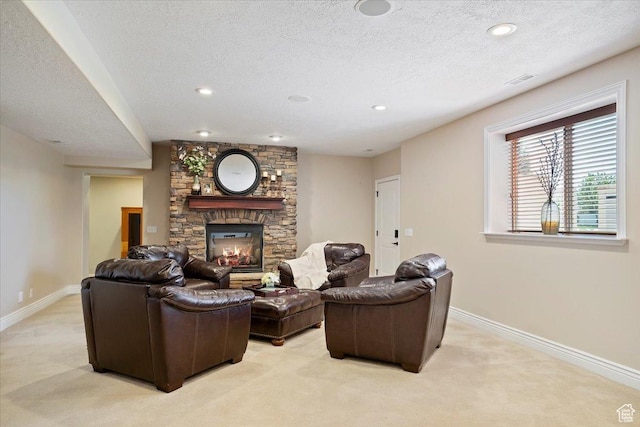864 S Wellington Dr W, Kaysville, UT 84037 - living area with light carpet, a textured ceiling, a fireplace, baseboards, and recessed lighting