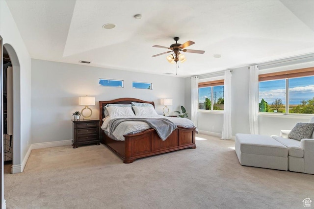 864 S Wellington Dr W, Kaysville, UT 84037 - bedroom with light carpet, arched walkways, baseboards, and a ceiling fan
