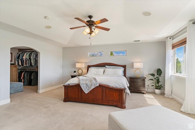 864 S Wellington Dr W, Kaysville, UT 84037 - bedroom featuring light carpet, baseboards, arched walkways, and a ceiling fan