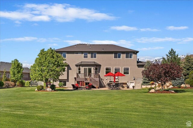864 S Wellington Dr W, Kaysville, UT 84037 - rear view of house with stucco siding, a yard, and a patio area