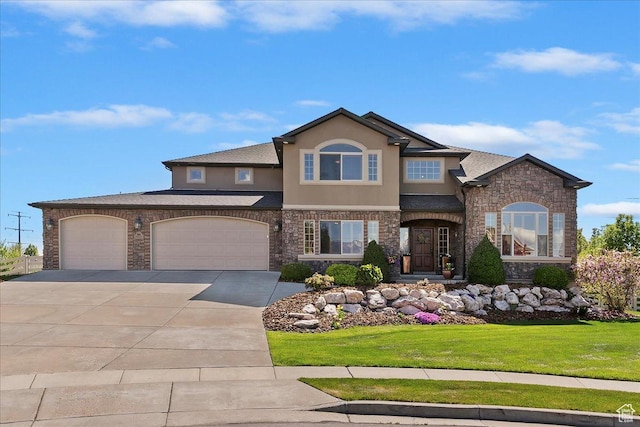 864 S Wellington Dr W, Kaysville, UT 84037 - view of front of home with stucco siding, stone siding, concrete driveway, a front yard, and a garage