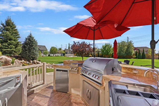 864 S Wellington Dr W, Kaysville, UT 84037 - view of patio with a grill and exterior kitchen