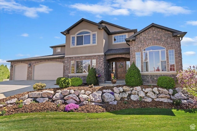864 S Wellington Dr W, Kaysville, UT 84037 - view of front facade with stone siding, stucco siding, and concrete driveway