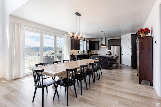 809 N 1490 E, Heber City, UT 84032 - dining area with light wood-style floors, a chandelier, recessed lighting, and baseboards