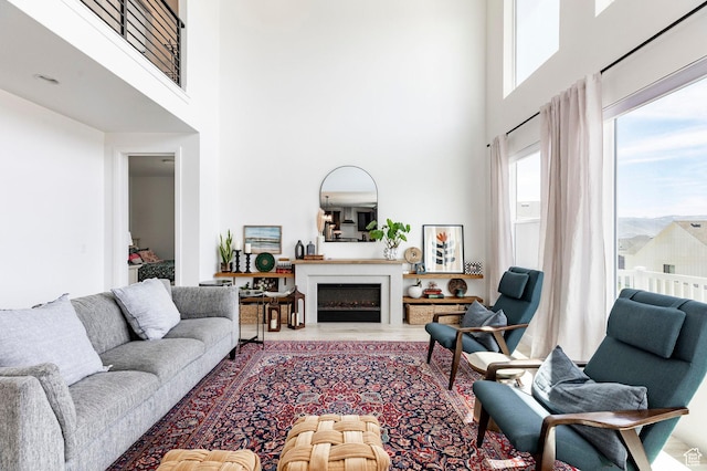 809 N 1490 E, Heber City, UT 84032 - living room featuring a towering ceiling, a fireplace, and wood finished floors