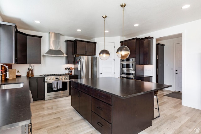 809 N 1490 E, Heber City, UT 84032 - kitchen with wall chimney range hood, stainless steel appliances, dark countertops, a sink, and light wood finished floors