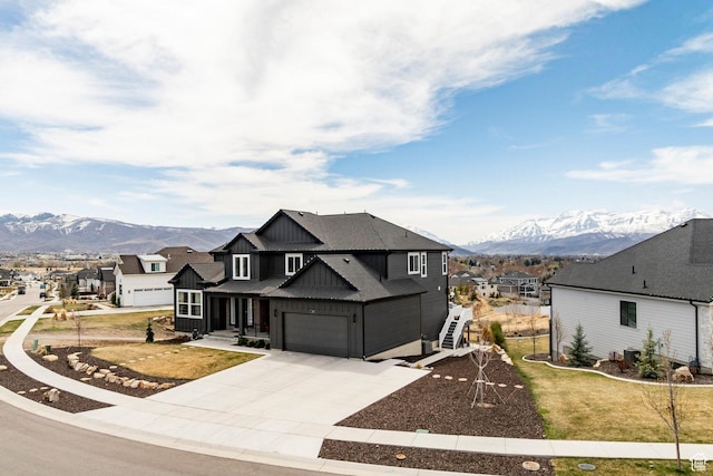 809 N 1490 E, Heber City, UT 84032 - view of front of home featuring a mountain view, a garage, driveway, board and batten siding, and a residential view