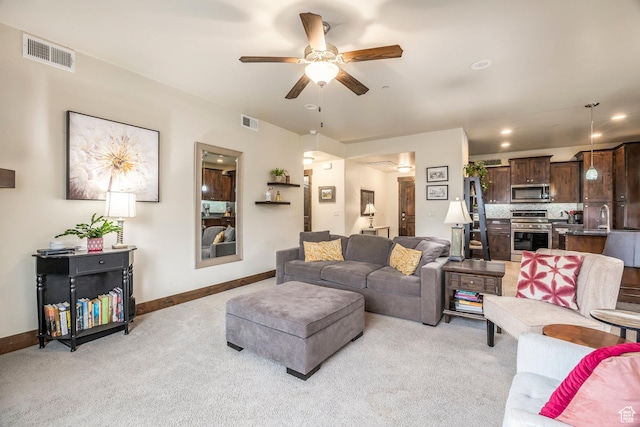 1261 W Black Rock Trl Unit 39F, Kamas, UT 84036 - living area with visible vents, a ceiling fan, baseboards, and light carpet