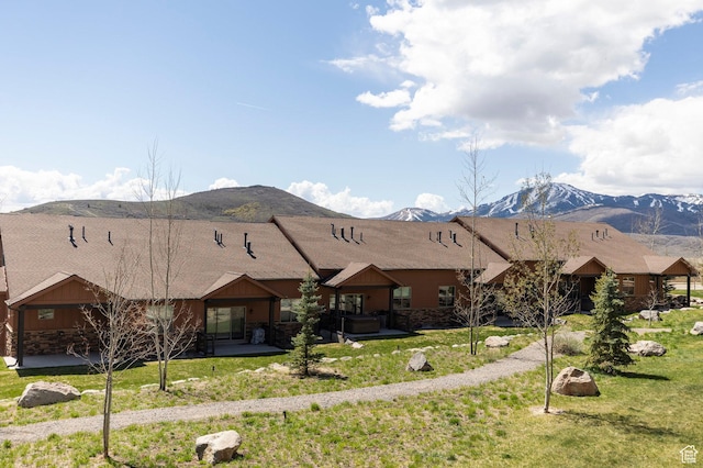 1261 W Black Rock Trl Unit 39F, Kamas, UT 84036 - ranch-style house with a mountain view, board and batten siding, a front yard, and stone siding