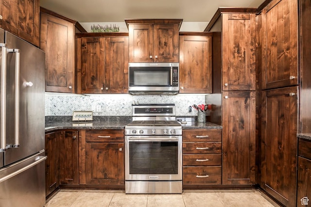 1261 W Black Rock Trl Unit 39F, Kamas, UT 84036 - kitchen featuring backsplash, stainless steel appliances, light tile patterned floors, and dark stone counters