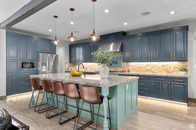 1021 Sage Crk, Heber City, UT 84032 - kitchen with decorative backsplash, appliances with stainless steel finishes, light wood-type flooring, light stone counters, and recessed lighting