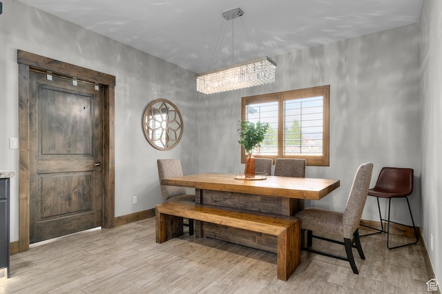 1021 Sage Crk, Heber City, UT 84032 - dining space with an inviting chandelier, baseboards, and light wood-type flooring