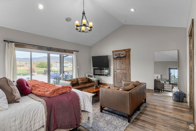 1021 Sage Crk, Heber City, UT 84032 - bedroom featuring an inviting chandelier, access to outside, multiple windows, and wood finished floors