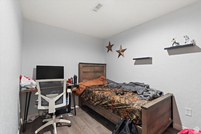 6268 S Faber Ln, Taylorsville, UT 84123 - bedroom featuring baseboards, wood finished floors, and visible vents