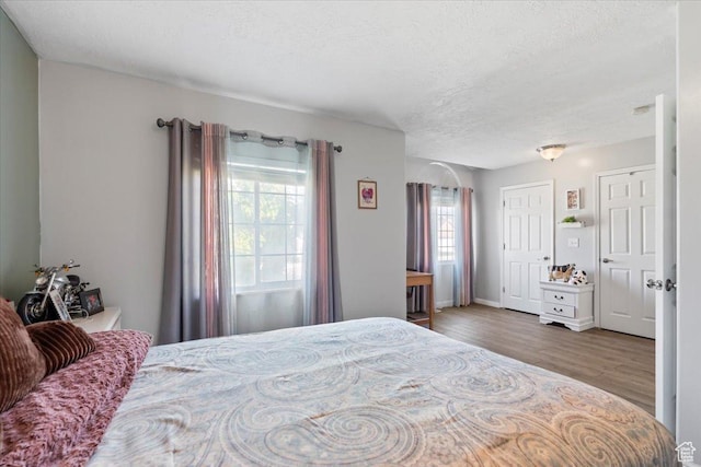 6268 S Faber Ln, Taylorsville, UT 84123 - bedroom featuring a textured ceiling and wood finished floors