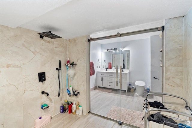 6268 S Faber Ln, Taylorsville, UT 84123 - bathroom with vanity, wood finished floors, and a tile shower